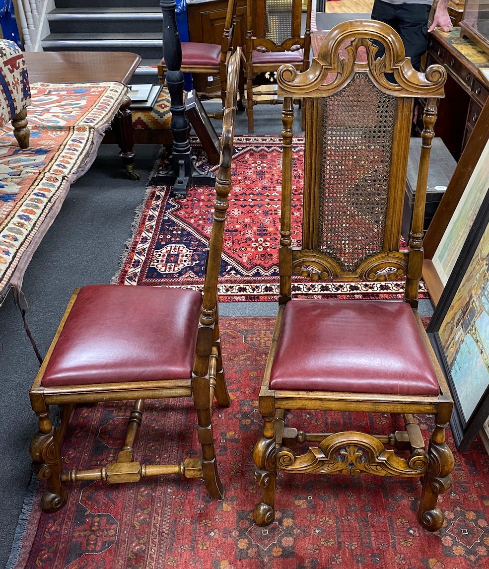 A set of ten early 20th century Jacobean Revival caned beech and walnut high back dining chairs, two with arms, standard chairs have drop in seats, elbows are caned.